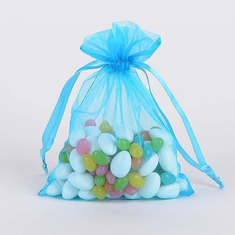 Sky blue sheer organza favor pouch filled with colorful candy
