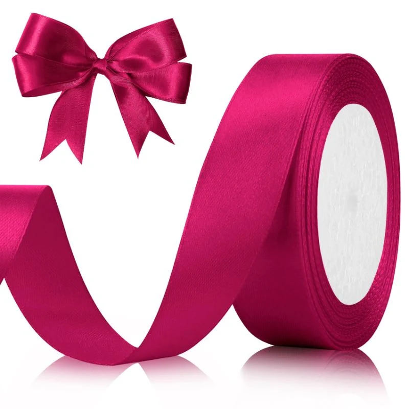 Magenta satin ribbon spool with pre-tied bow