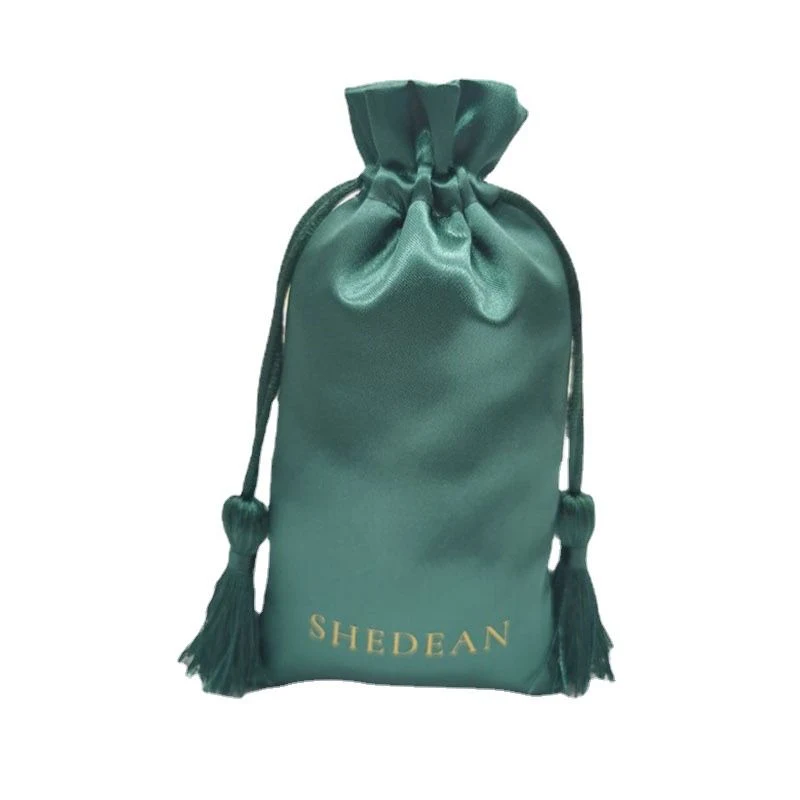 Emerald green satin pouch with tassels and gold foil logo