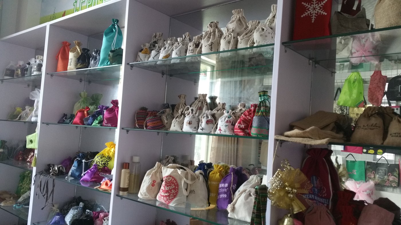 Genesis Bags showroom displaying hundreds of fabric pouch and bag samples